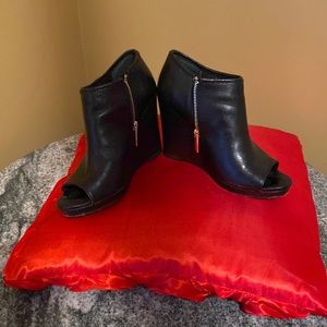 BCBG black toeless booties in leather, size 8..scuffs on back please view photos